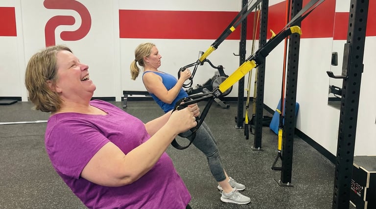 Woman training with TRX straps at Pierce Fitness